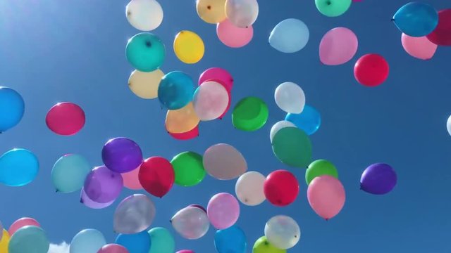 Many colorful balloons flying in the air. Celebration and birthday concept