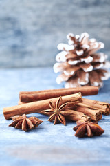 Star anise with cinnamon. Christmas spices on rustic wooden background. Copy space. 