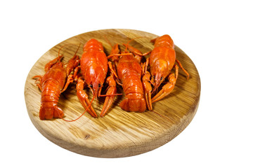 Boiled crayfish on wooden cutting board isolated on white background