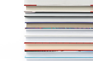 Books laid horizontally on a white background, aligned in a line