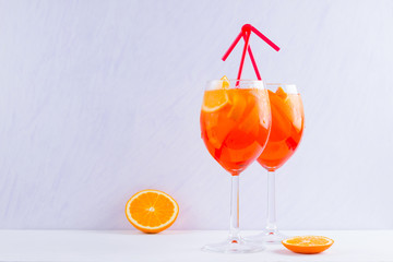 Aperol Spritz cocktail with mint leaves on a white background. Italian cocktail aperol spritz on white. Isolated