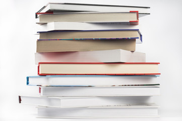 Books stacked in a pile on white background