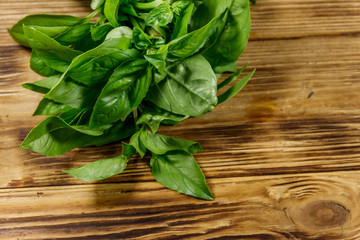Green basil on a wooden table