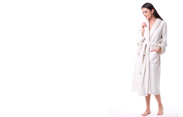 Studio shoot of model in white bathrobe.