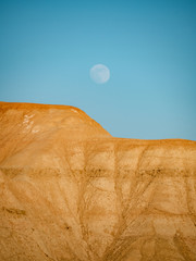 Moonrise over desert textures and colors