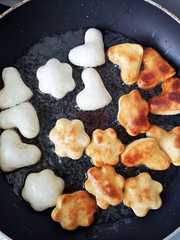 Frying doughnuts in the pan - homemade dessert  - cooking  at home