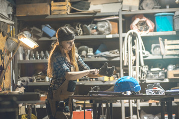 young woman working in a workshop