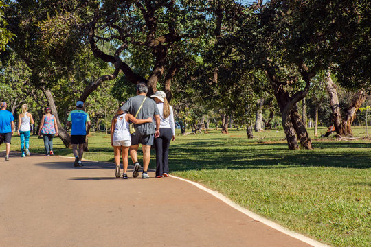 Mother and daughter play outdoor sport in city park