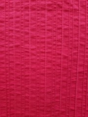 Bright pink textured fabric background