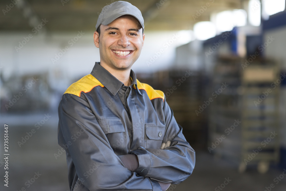 Wall mural Portrait of a smiling industrial worker