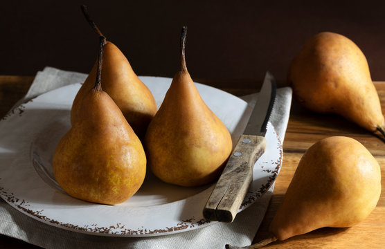 Ripe pears in a rustic setting.
