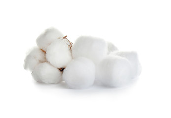 Obraz na płótnie Canvas Balls of fluffy cotton and flower on white background