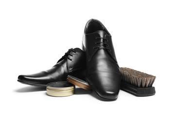 Stylish men's footwear and shoe care accessories on white background