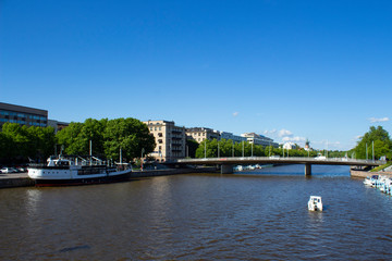 Bridge over the river Auraioki and old vintage ship in Turku city in Finland on a summer day.