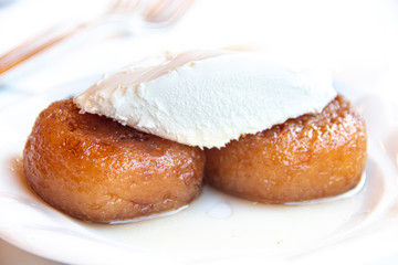 Turkish dessert Kemalpasa with cream.	