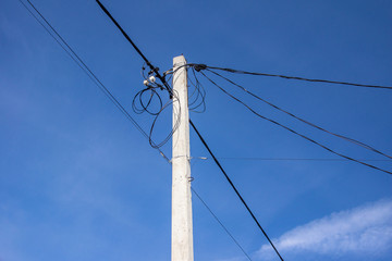 overhead cable and electrical cable on the pole