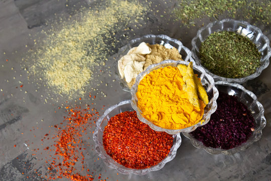 Colourful various herbs and spices for cooking on isolated background