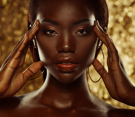 Portrait of Young African model with a beautiful makeup in studio