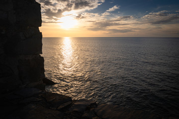 Fototapeta premium scenic view with sunset on atlantic ocean with rocks in socoa, basque country, france