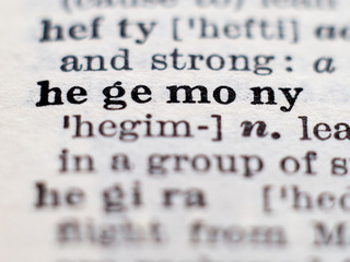 Dictionary definition of word hegemony. Selective focus.