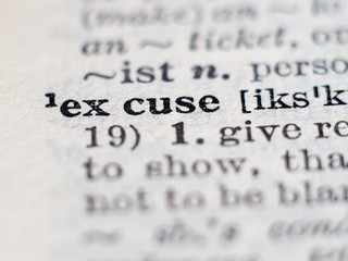 Dictionary definition of word excuse. Selective focus.