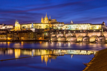 Fototapeta na wymiar Panorama of Prague Castle and St. Vitus cathedral in twilight with dramatic sky. Prague, Czech Republic