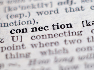 Dictionary definition of word connection. Selective focus.