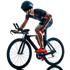 Fototapeta na wymiar triathlete triathlon Cyclist cycling in studio silhouette shadow isolated on white background