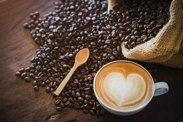 coffee latte with coffee beans  on dark background, top view