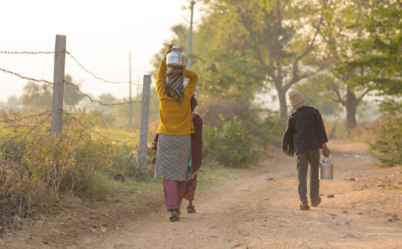 Rural Girl Carry Water