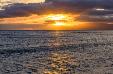 Ocean Sunset - Colorful sunset at north-west coast of Maui, with Lanai island at horizon. Hawaii, USA.