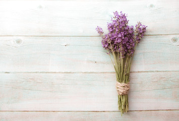 Vintage background of Composition of lavender on white wood. Border of fresh summer flowers. Free space