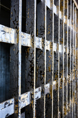 Rusted bars inside a jail cell