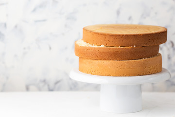 Sponge cake. Shortcakes on a white cake stand