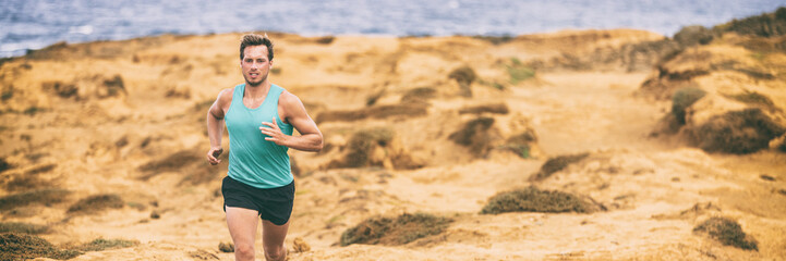Fototapeta premium Run man fit active lifestyle running on sand hills outdoor in nature beach banner panorama. Sports and fitness people landscape.