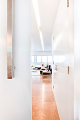 Modern hallway with white walls to the living room