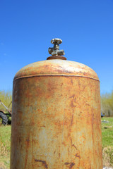 Fototapeta na wymiar Old Rusted Propane Cylinder