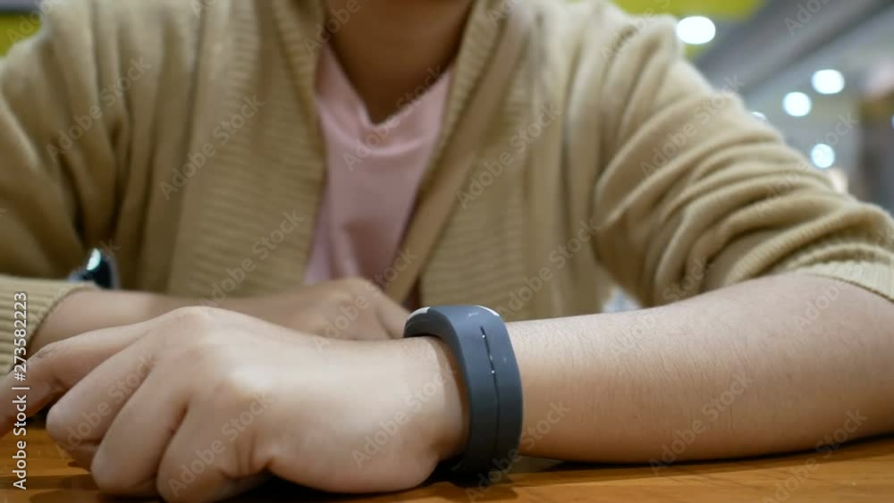 Aufkleber hands of woman using smart watch for cyber and futuristic concept select focus shallow depth of fiel