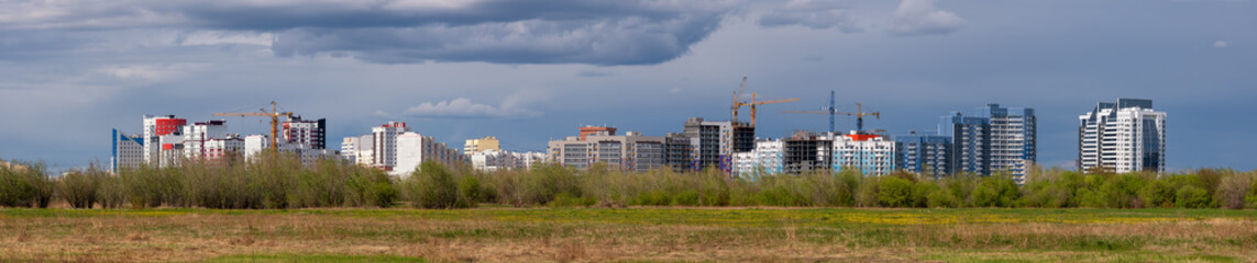 Fototapeta na wymiar Panorama of new buildings. Yakutsk Midtown skyline panorama in new district, Yakutia 