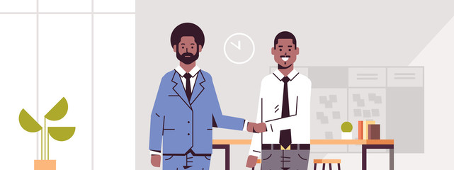 business partners man woman handshaking african american couple hand shake during meeting agreement partnership concept modern co-working center office interior flat portrait horizontal