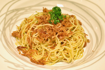 Pasta homemade, Spaghetti aglio e olio with spicy corn beef, chilli, olive oil and garlic, Italian fusion food.