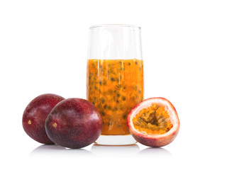 Fresh passion fruit juice in glass with green leaf isolated on white background, fruit healthy concept