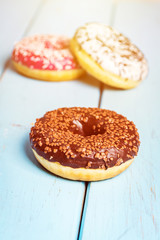 Sweet donuts on black stone table