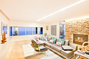 Modern living room illuminated with yellow lights