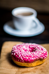 Pink donut with white sprinkle