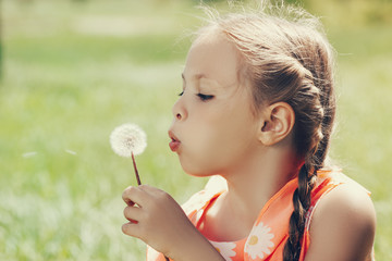 blow on a dandelion