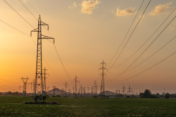 Fototapeta na wymiar Sunset Landscape of High-voltage power lines in the land around city of Plovdiv, Bulgaria