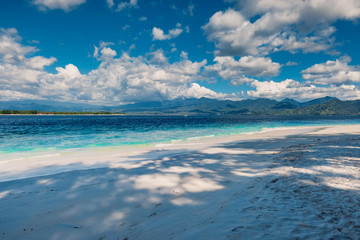 Tropical beach and blue ocean in paradise island