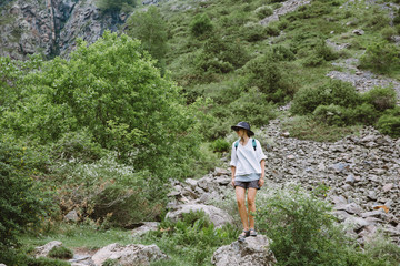 Young woman tourist in the mountains