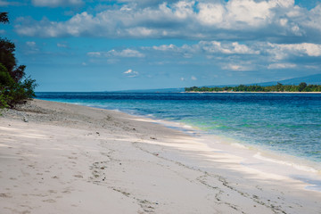 Tropical beach and blue ocean in paradise island